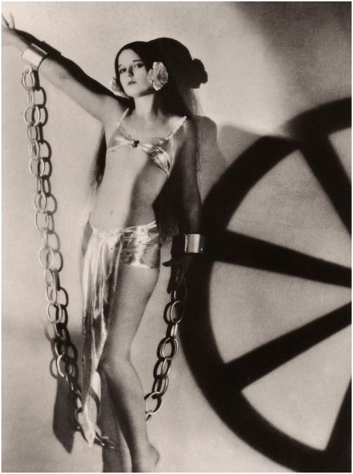 chorus girl in huge fake chains and shackles