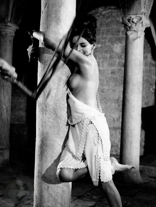 Barbara Steele tied to a stone column and whipped in the movies