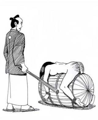 japanese girl over a barrel for a beating with a bundle of rods