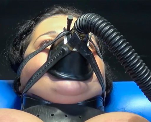 gas mask strapped to her face