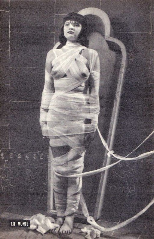 Bondage mummy is very alive, but wrapped in restraining bandages and ready to go into the tomb!
