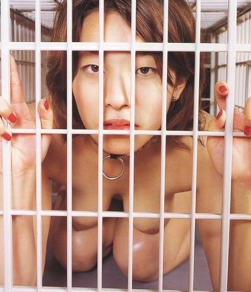 collared asian slavegirl in a white metal cage