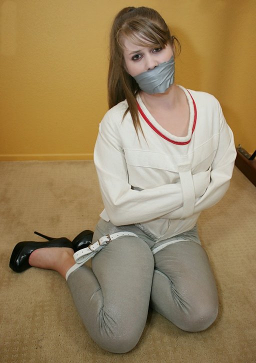 gagged and straitjacketed