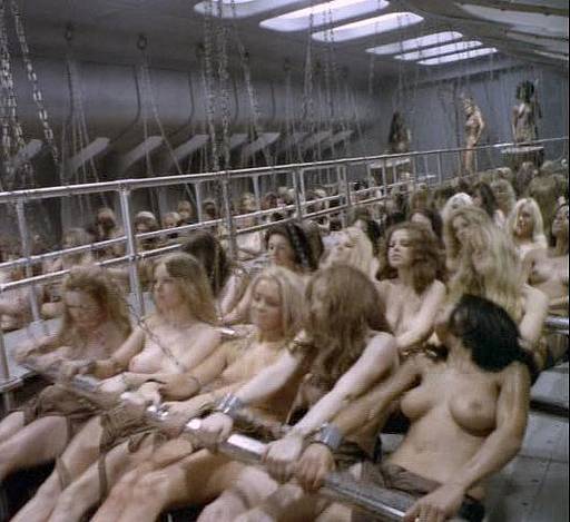 nude women chained to the oars and laboring under the whip