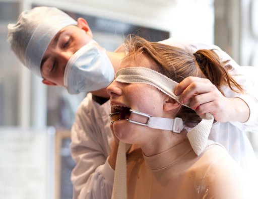 blindfolded and gagged prior to a public force feeding