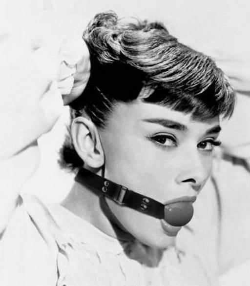 Audrey Hepburn wearing a ball gag