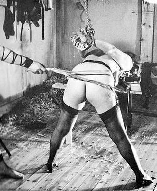 vintage rope bondage whipping scene