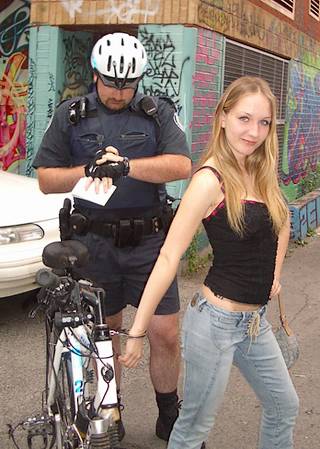 handcuff bondage for woman arrested by a bicycle cop