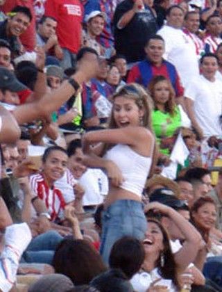 soccer hooligan girl shows her titties to the crowd