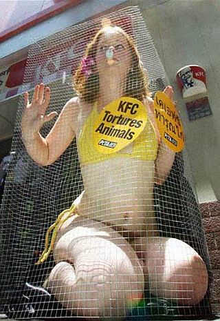 protester in a chicken wire cage