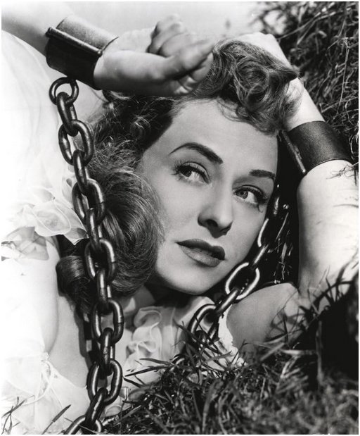 Paulette Goddard in iron or steel chains