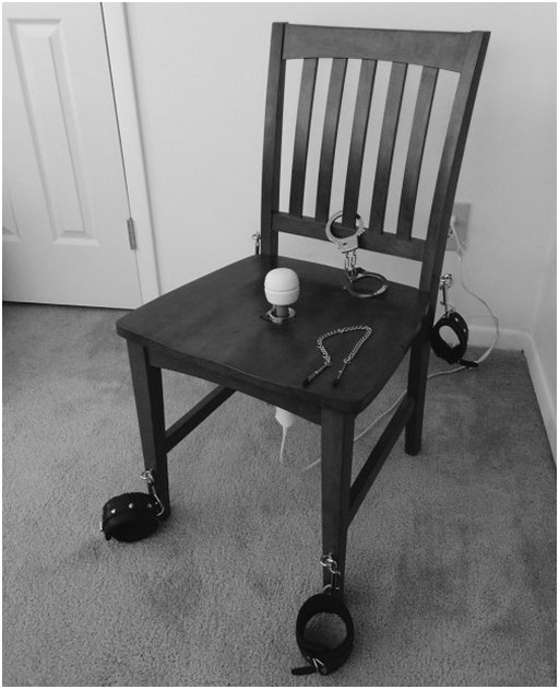 bondage pleasure chair with a Magic Wand in the seat and lots of cuffs to keep your slave in place for many forced orgasms