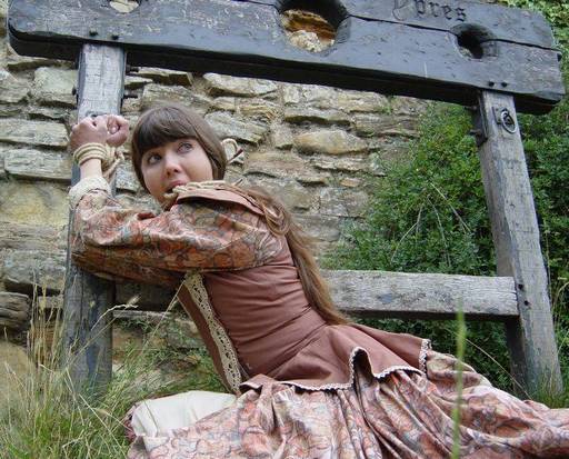 Rosaleen Young tied to a pillory