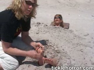buried in sand for helpless feet tickling
