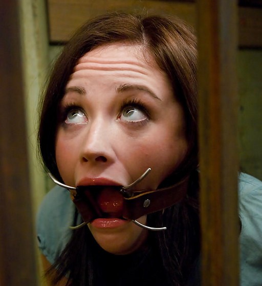sindee jennings looking apprehensive in a spider gag