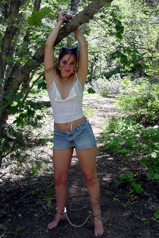 handcuffed to a tree for summer bondage fun