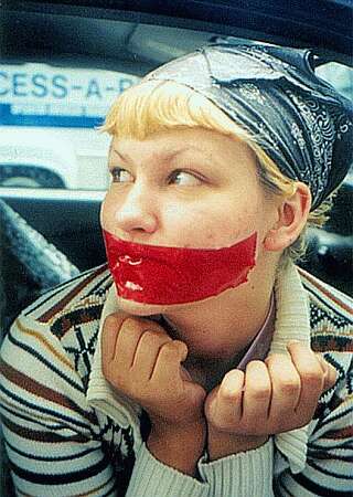 celebrity protester has mouth taped shut in public