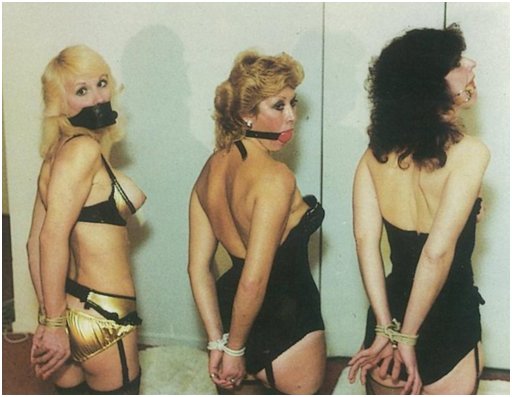 three gagged women with tied wrists