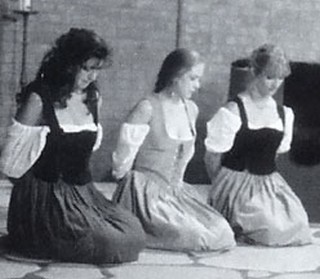 three women kneeling in submission