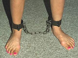 pretty feet in steel bondage