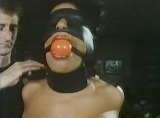 Vanessa del Rio blindfolded and wearing a ball gag
