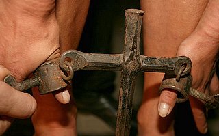 medieval thumbscrews to hold a woman bent over on the whipping block